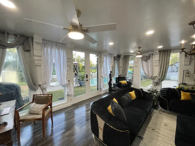 a living room with furniture and a flat screen tv
