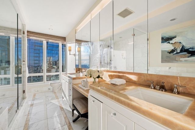 a bath room with a sink and a bath tub