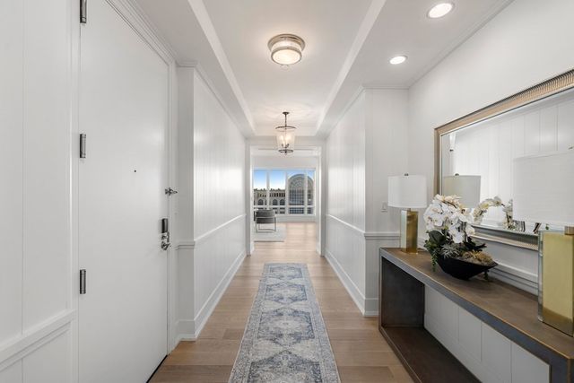 a view of a hallway with dining area