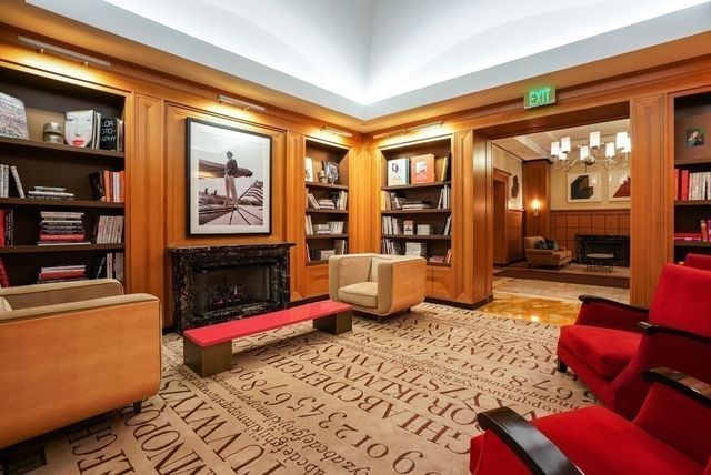 a bedroom with furniture and a book shelf