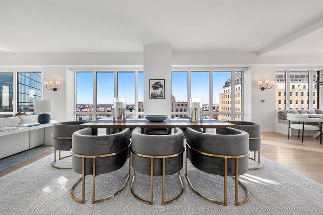 a kitchen with a table and chairs