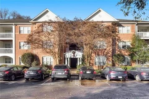 5601 Fairview Road, Unit 26 Charlotte, NC 28209 - Photo 1 of 22 a view of a parked cars in front of a building