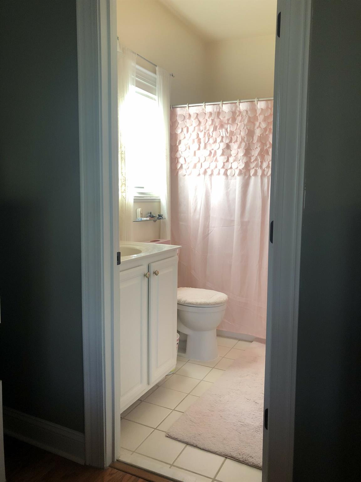 5601 Fairview Road, Unit 26 Charlotte, NC 28209 - Photo 16 of 22 a bathroom with a toilet sink and window