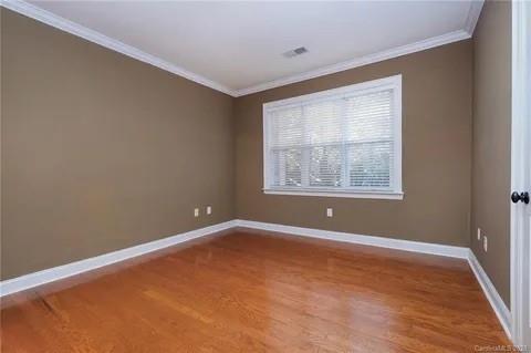 5601 Fairview Road, Unit 26 Charlotte, NC 28209 - Photo 21 of 22 an empty room with windows