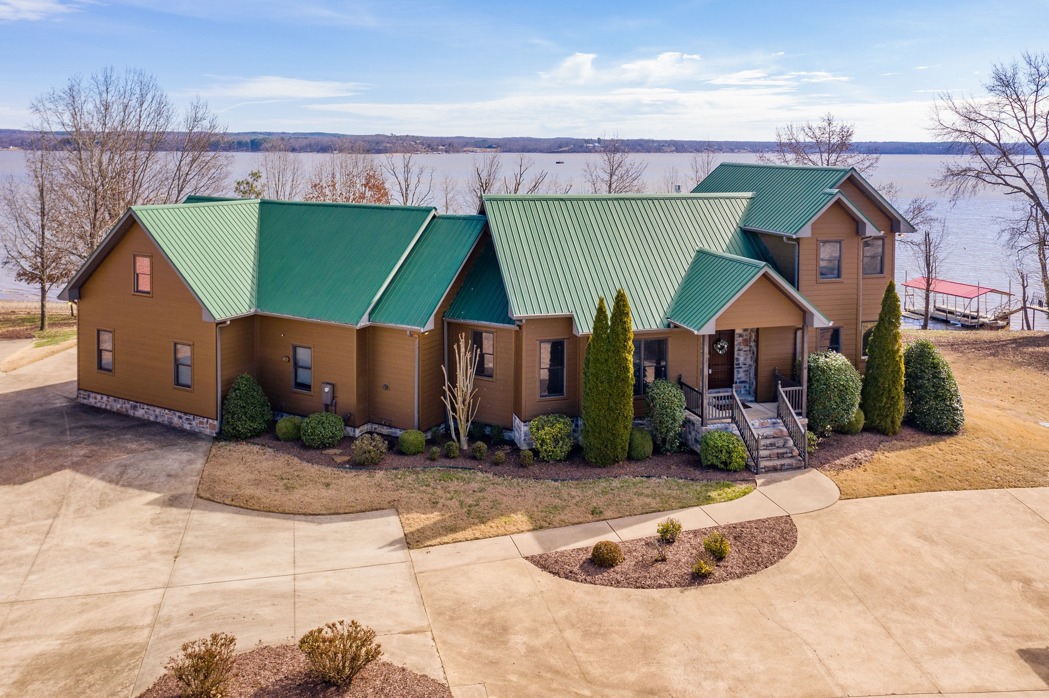 60 Lakeside Estates Road Springville, TN 38256 - Photo 1 of 49 a front view of a house with a yard and garage