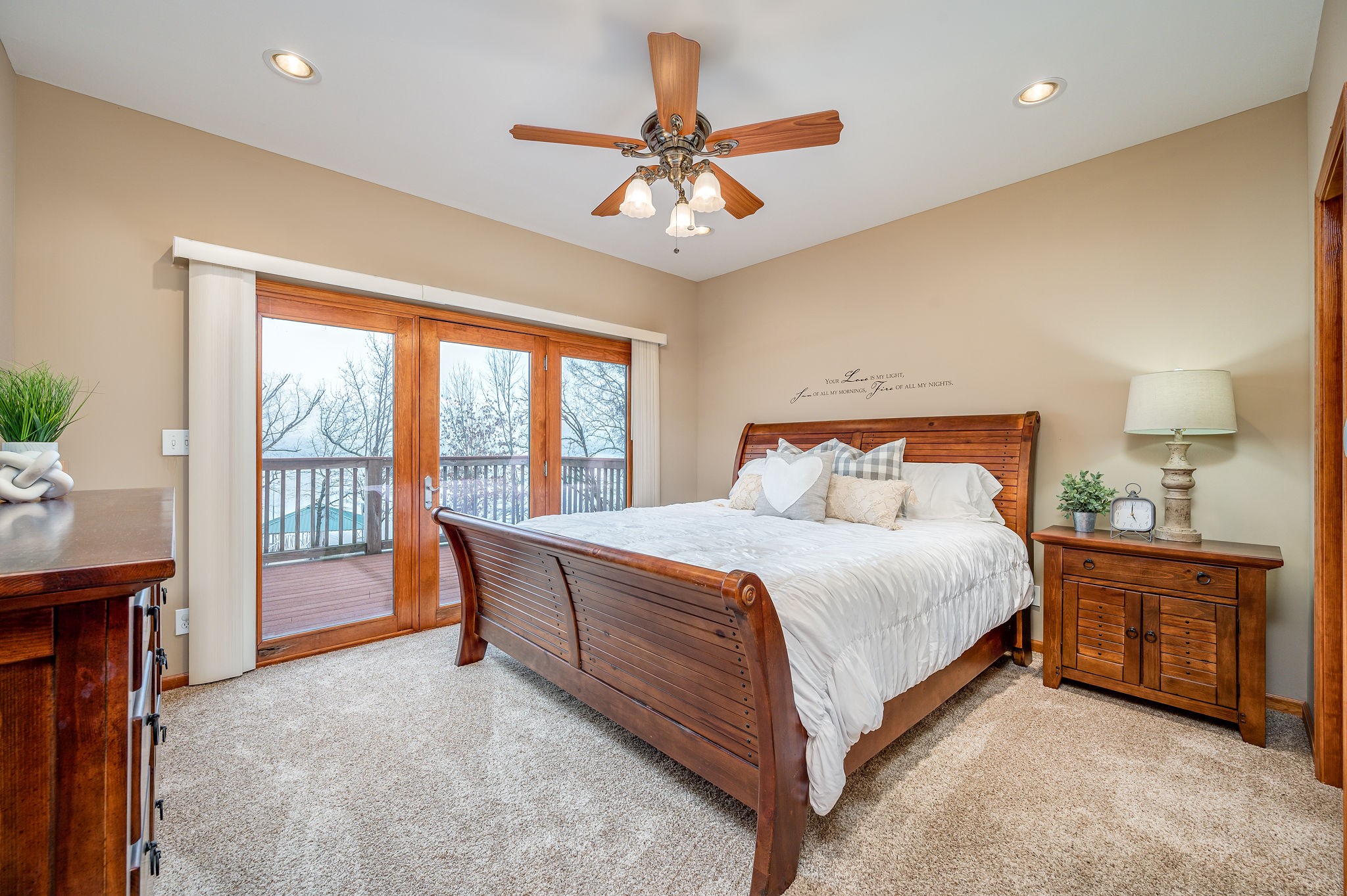 60 Lakeside Estates Road Springville, TN 38256 - Photo 16 of 49 a bedroom with a bed and a chandelier