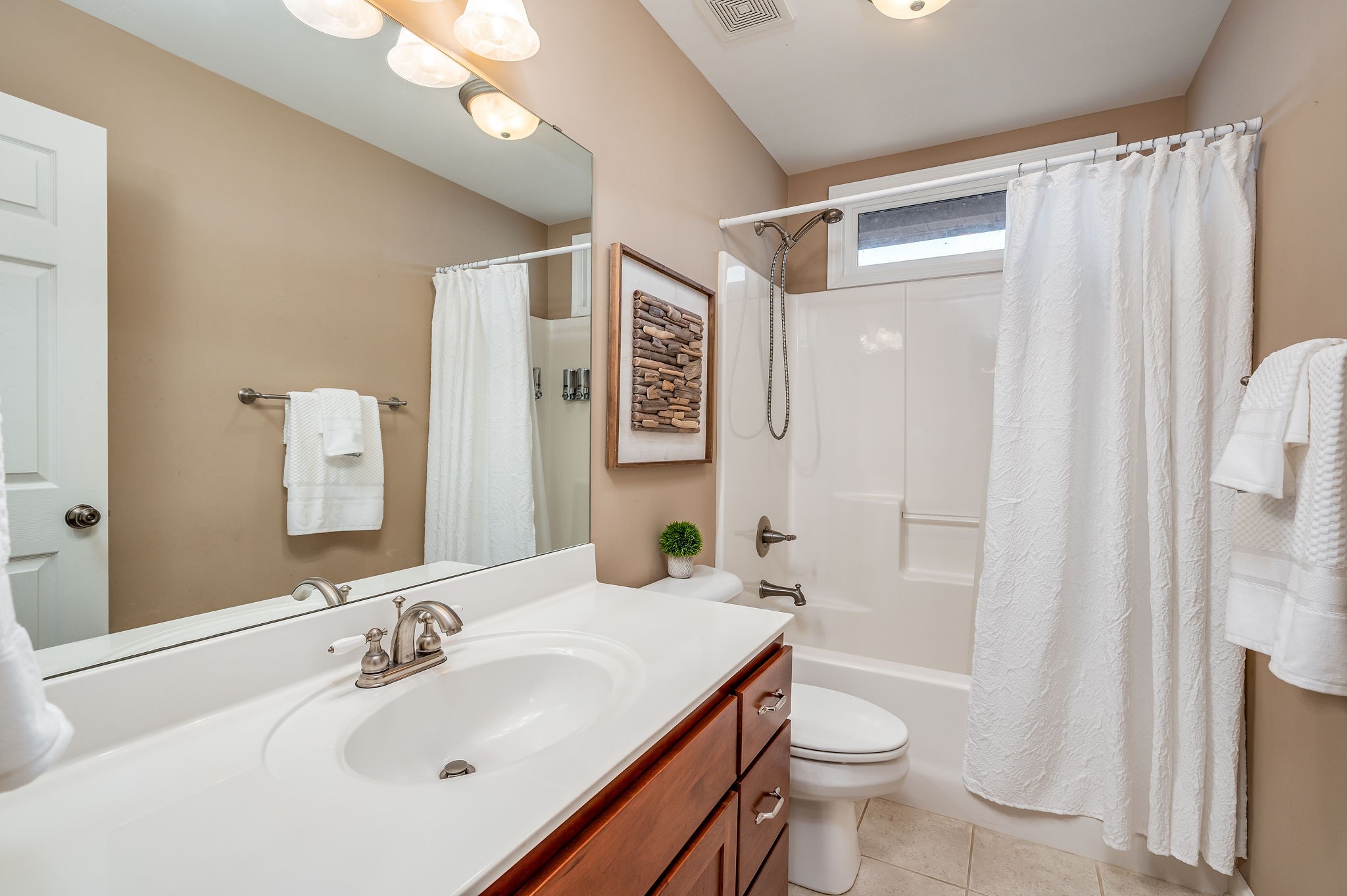 60 Lakeside Estates Road Springville, TN 38256 - Photo 25 of 49 a bathroom with a sink toilet and shower