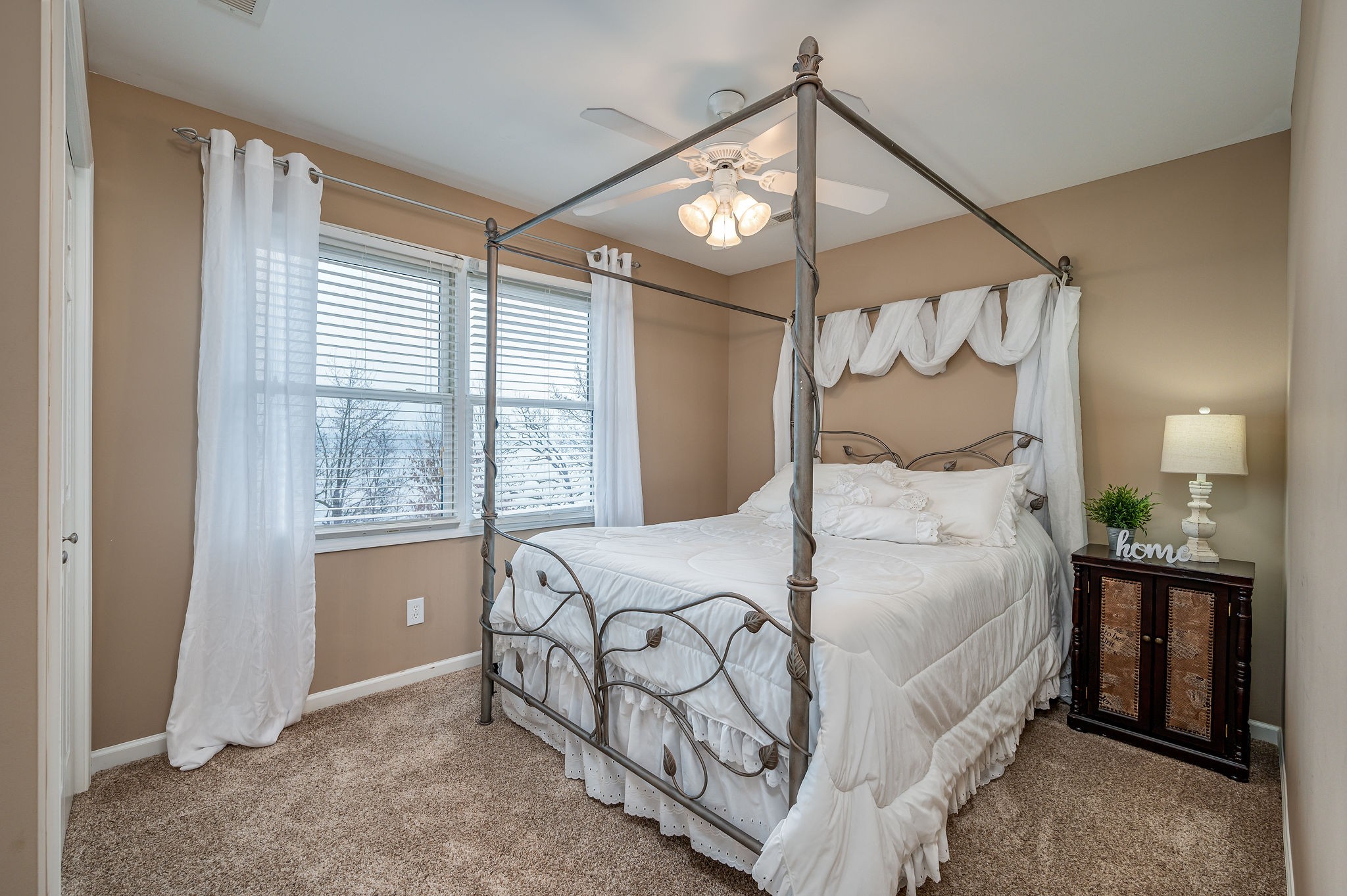 60 Lakeside Estates Road Springville, TN 38256 - Photo 26 of 49 a bedroom with a bed and a mirror on the dresser
