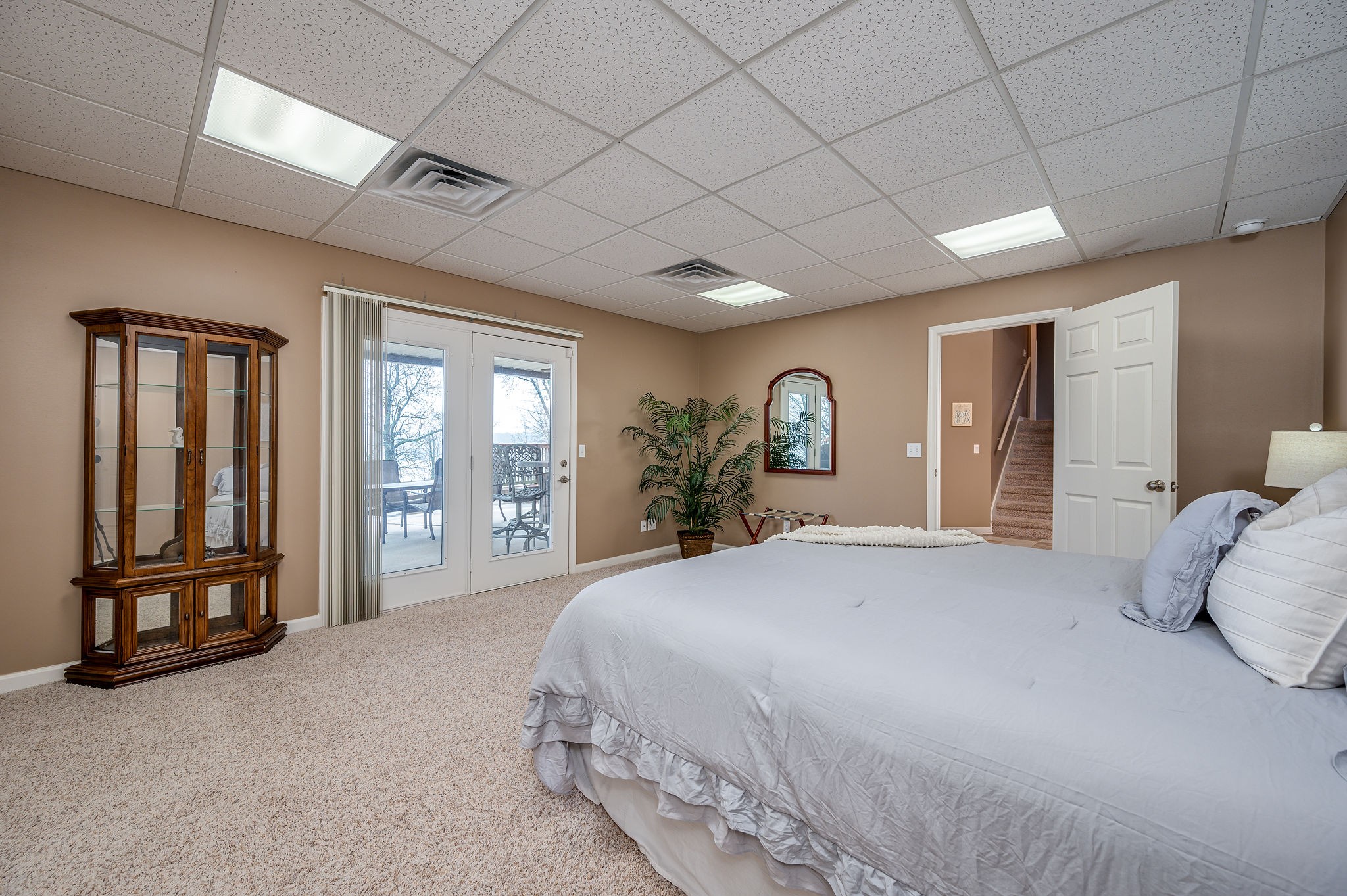 60 Lakeside Estates Road Springville, TN 38256 - Photo 31 of 49 a spacious bedroom with a large bed and a large window
