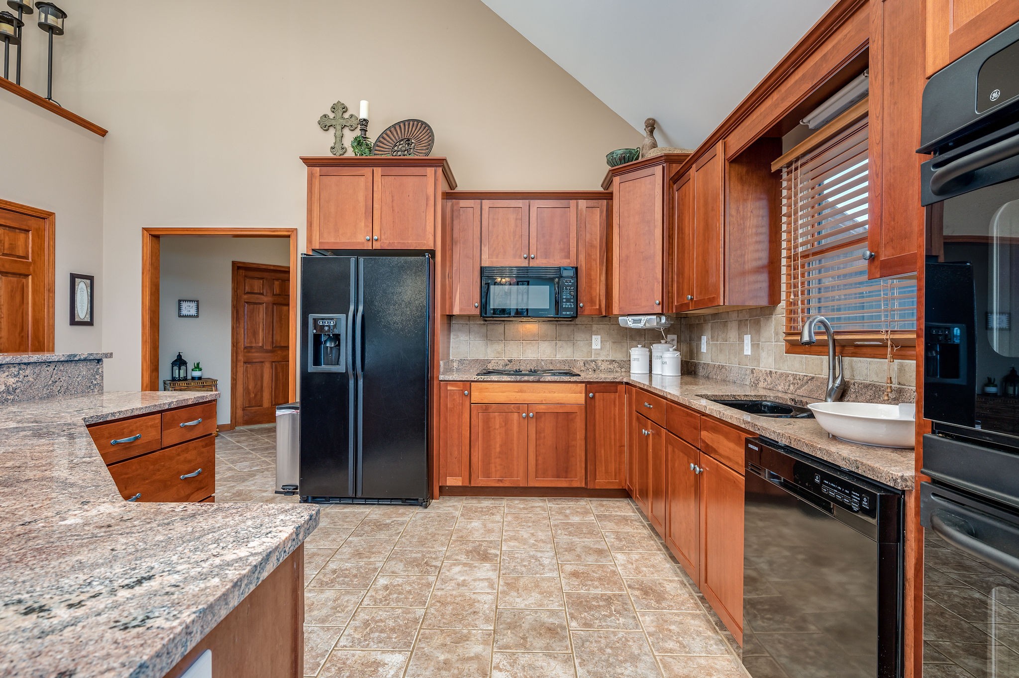60 Lakeside Estates Road Springville, TN 38256 - Photo 9 of 49 a kitchen with stainless steel appliances granite countertop a stove a sink and a refrigerator