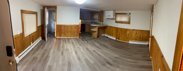 a view of a room with wooden floor and balcony