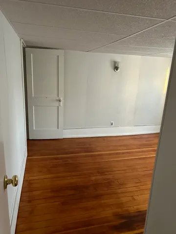 a view of room with wooden floor