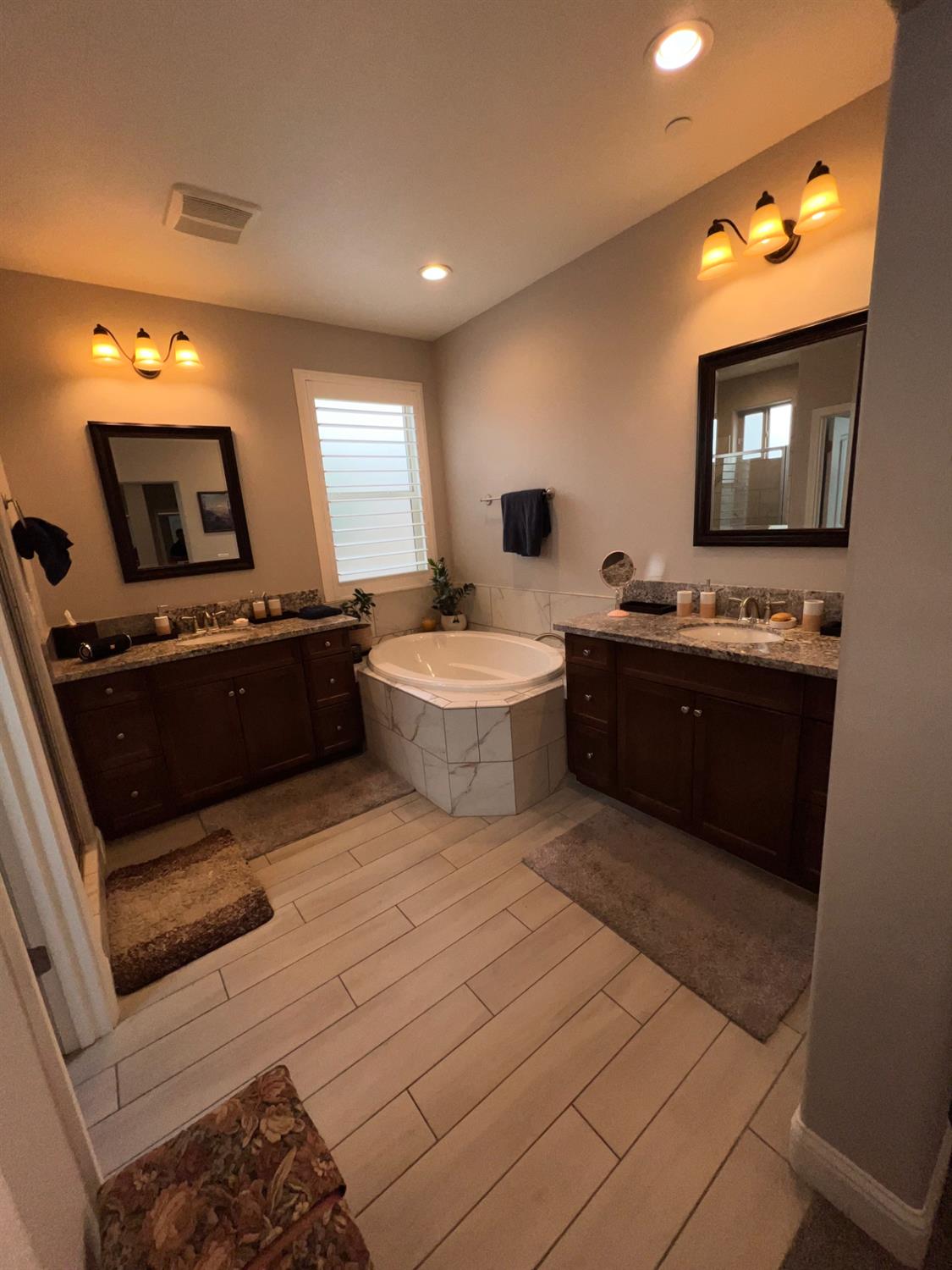 889 Coloma Place Madera, CA 93637 - Photo 38 of 61 a large kitchen with stainless steel appliances a stove a sink and a microwave