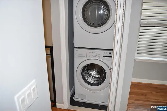 a view of a hallway with washer and dryer