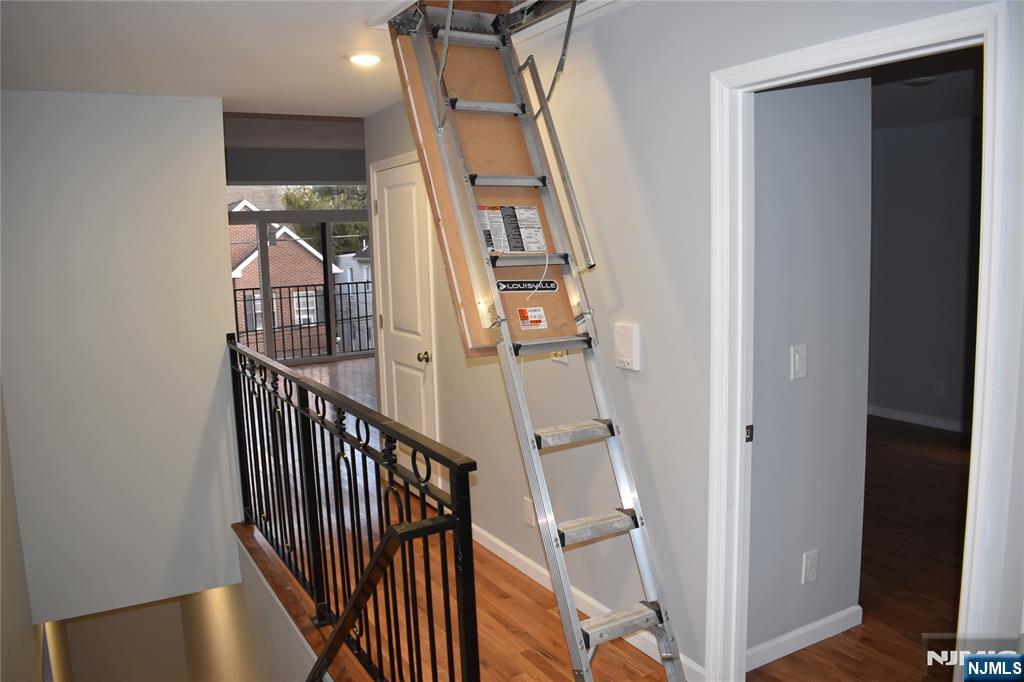 593 South 18th Street Newark, NJ 07103 - Photo 7 of 16 a view of staircase with railing and white walls