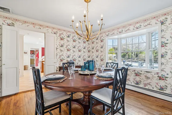 a view of a dining room with furniture window and wooden floor