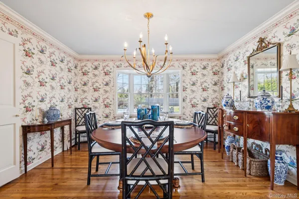 a view of a dining room with furniture and wooden floor