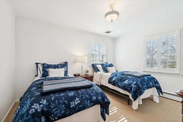 a bedroom with bed and window
