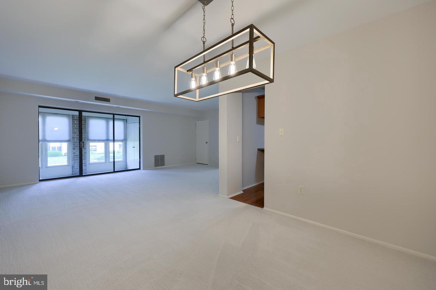 4 Valleybrook Drive Lancaster, PA 17601 - Photo 6 of 19 a view of an empty room with chandelier fan and wooden floor