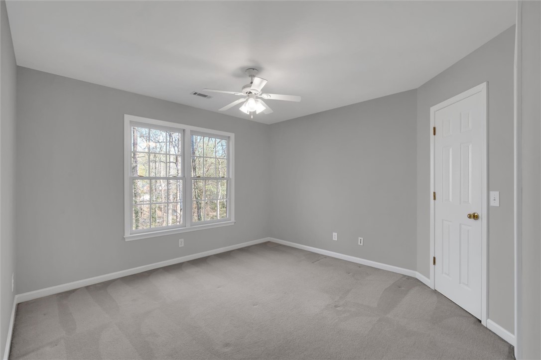204 Red Maple Way Clemson, SC 29631 - Photo 34 of 48 This spacious bedroom offers ample natural light and comfortable carpeting, perfect for relaxation.