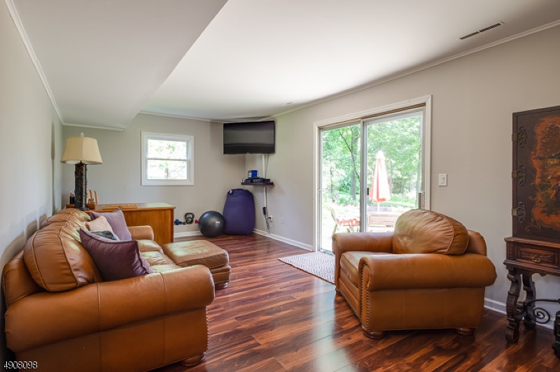 14 Ash Lane Randolph, NJ 07869 - Photo 15 of 22 a living room with furniture a flat screen tv and a large window