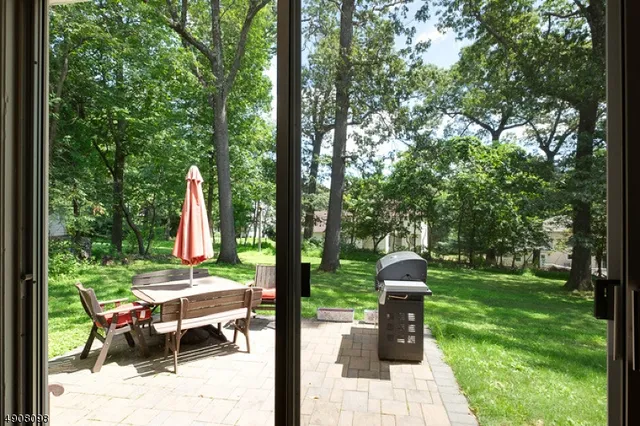 a table and chairs in the garden