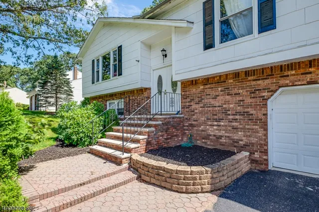 front view of a house with a fountain