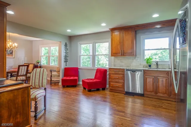 a living room with furniture window and wooden floor