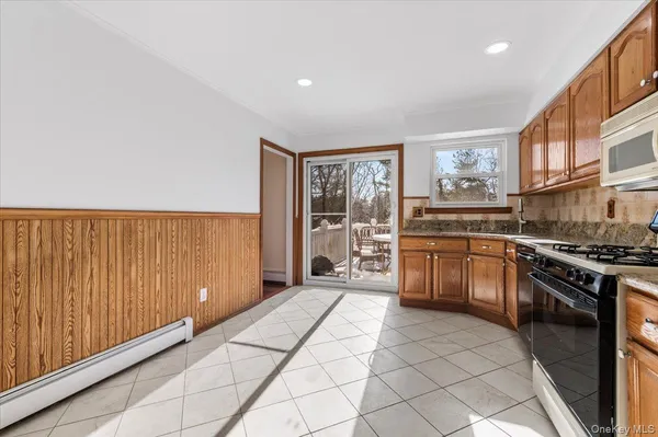 a kitchen with stainless steel appliances a stove a sink and a refrigerator