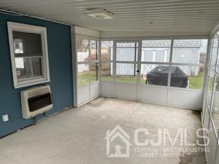 20 Ramsey Road Middlesex, NJ 08846 - Photo 22 of 33 a view of an empty room with a fireplace and a large window