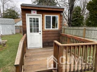 20 Ramsey Road Middlesex, NJ 08846 - Photo 23 of 33 a balcony of a house with wooden floor and fence