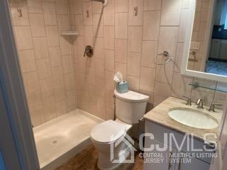 20 Ramsey Road Middlesex, NJ 08846 - Photo 26 of 33 a bathroom with a sink and a mirror