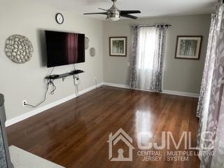 20 Ramsey Road Middlesex, NJ 08846 - Photo 10 of 33 a view of a livingroom with wooden floor and flat screen tv