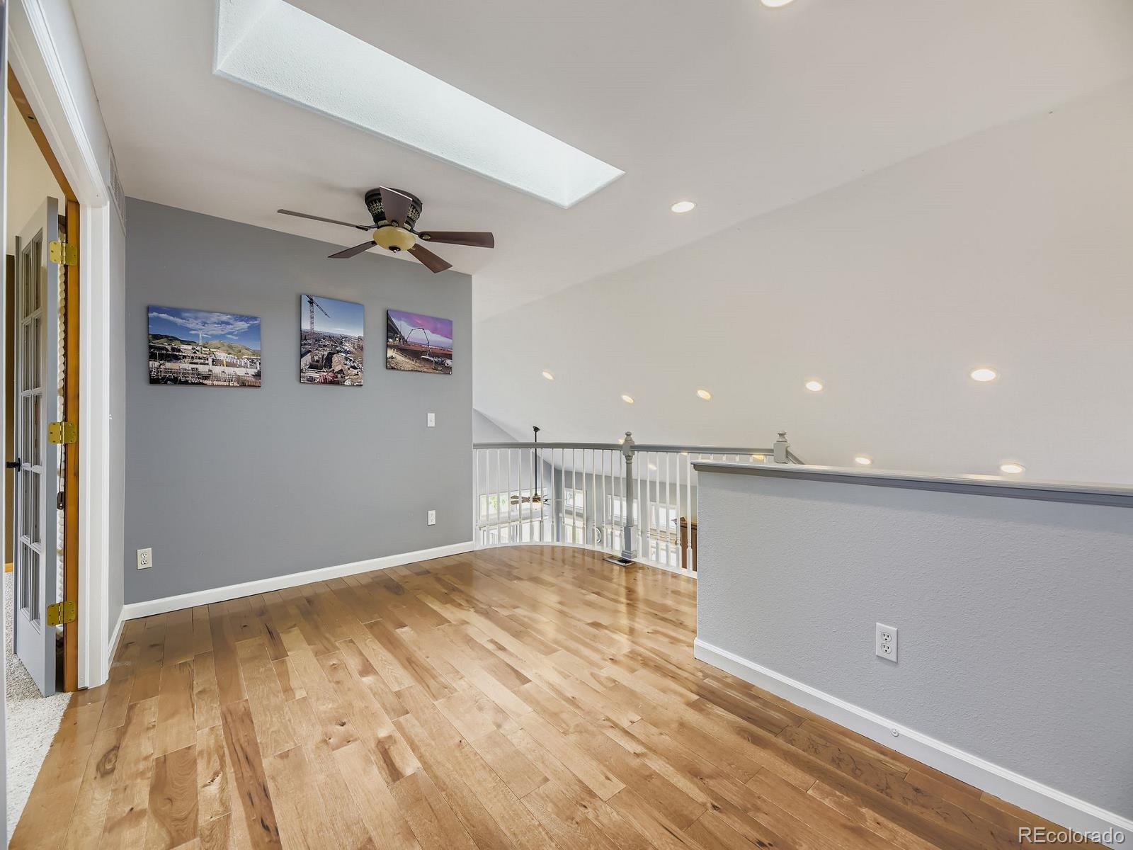 15906 Double Eagle Drive Morrison, CO 80465 - Photo 19 of 34 a view of empty room with wooden floor