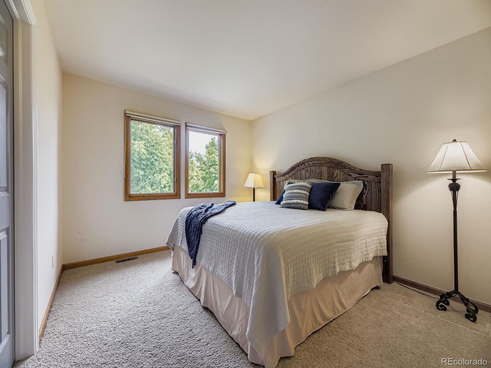 15906 Double Eagle Drive Morrison, CO 80465 - Photo 20 of 34 a bedroom with a bed and a window