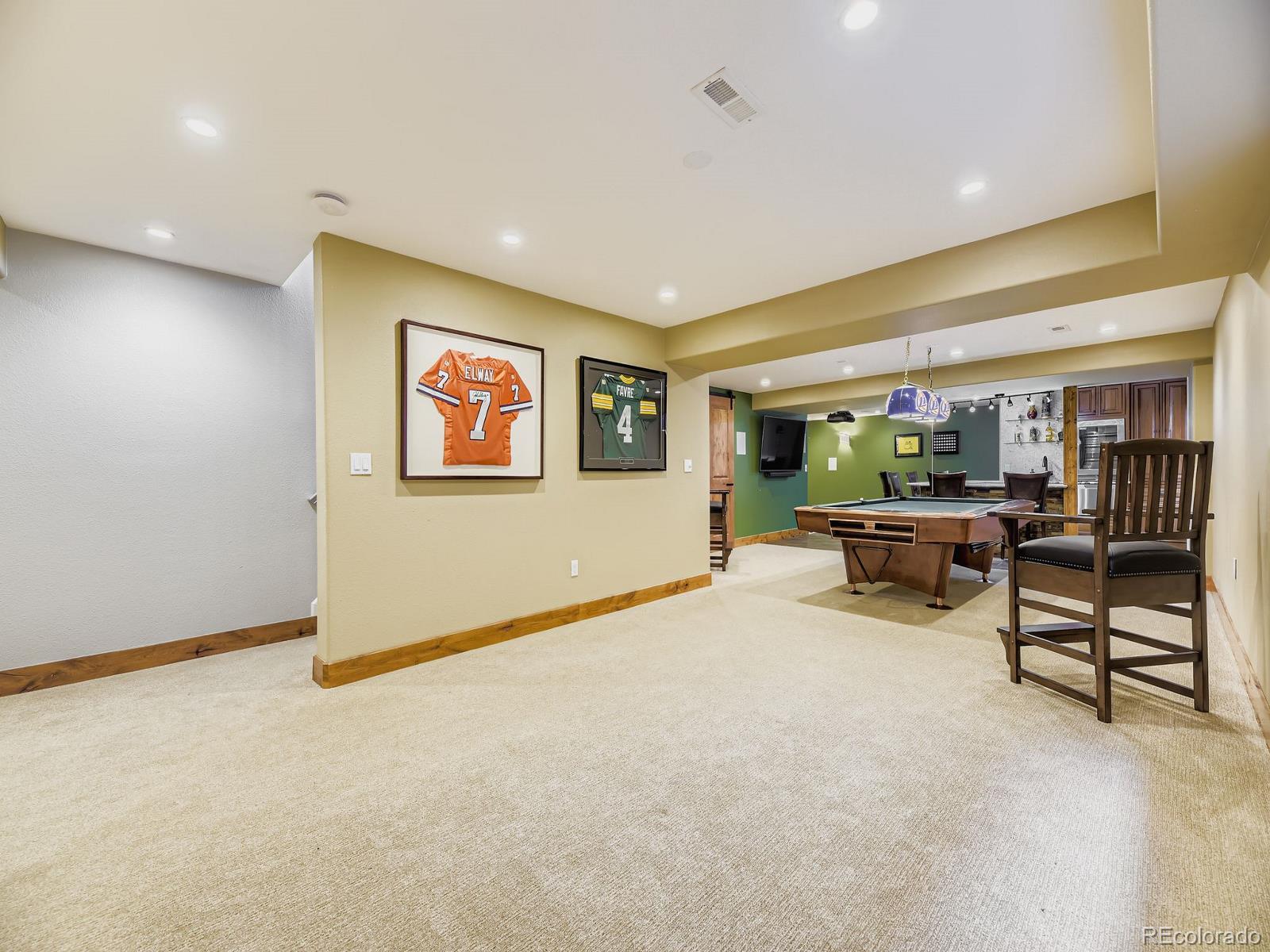 15906 Double Eagle Drive Morrison, CO 80465 - Photo 23 of 34 a living room with furniture and a flat screen tv