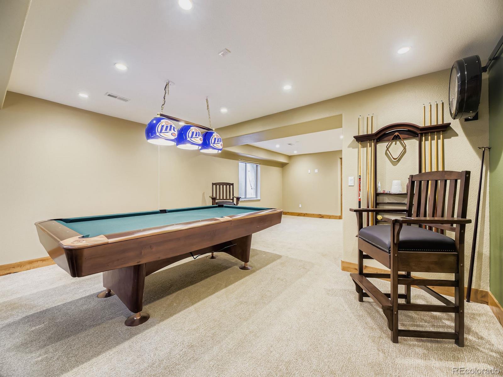 15906 Double Eagle Drive Morrison, CO 80465 - Photo 24 of 34 a room with wooden floor and furniture