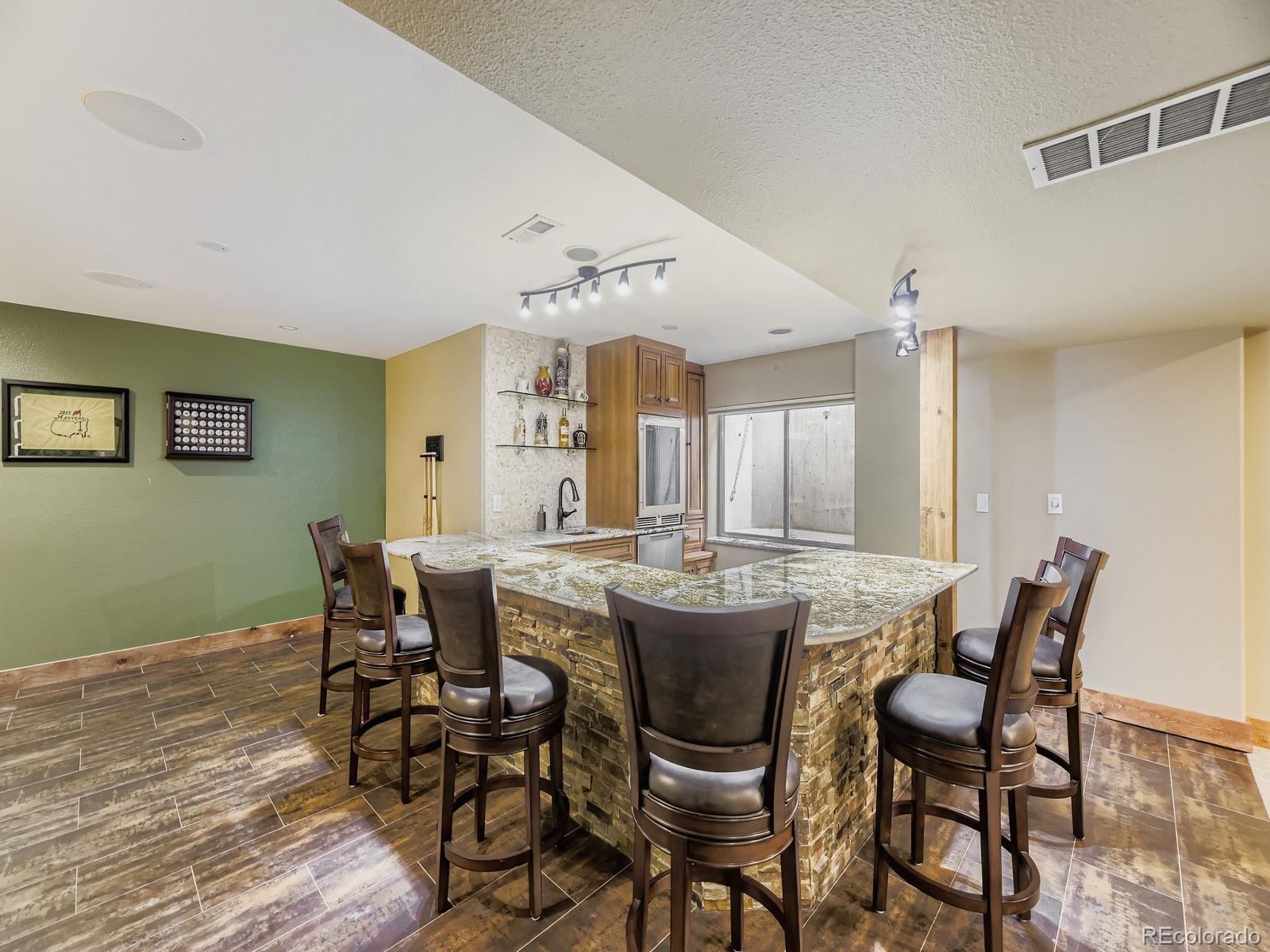 15906 Double Eagle Drive Morrison, CO 80465 - Photo 25 of 34 a view of a dining room with furniture and chandelier
