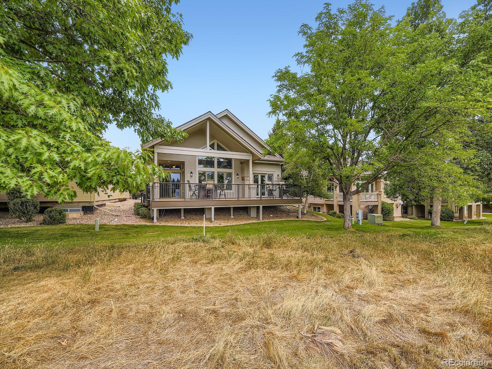 15906 Double Eagle Drive Morrison, CO 80465 - Photo 34 of 34 a view of a house with a yard and sitting area