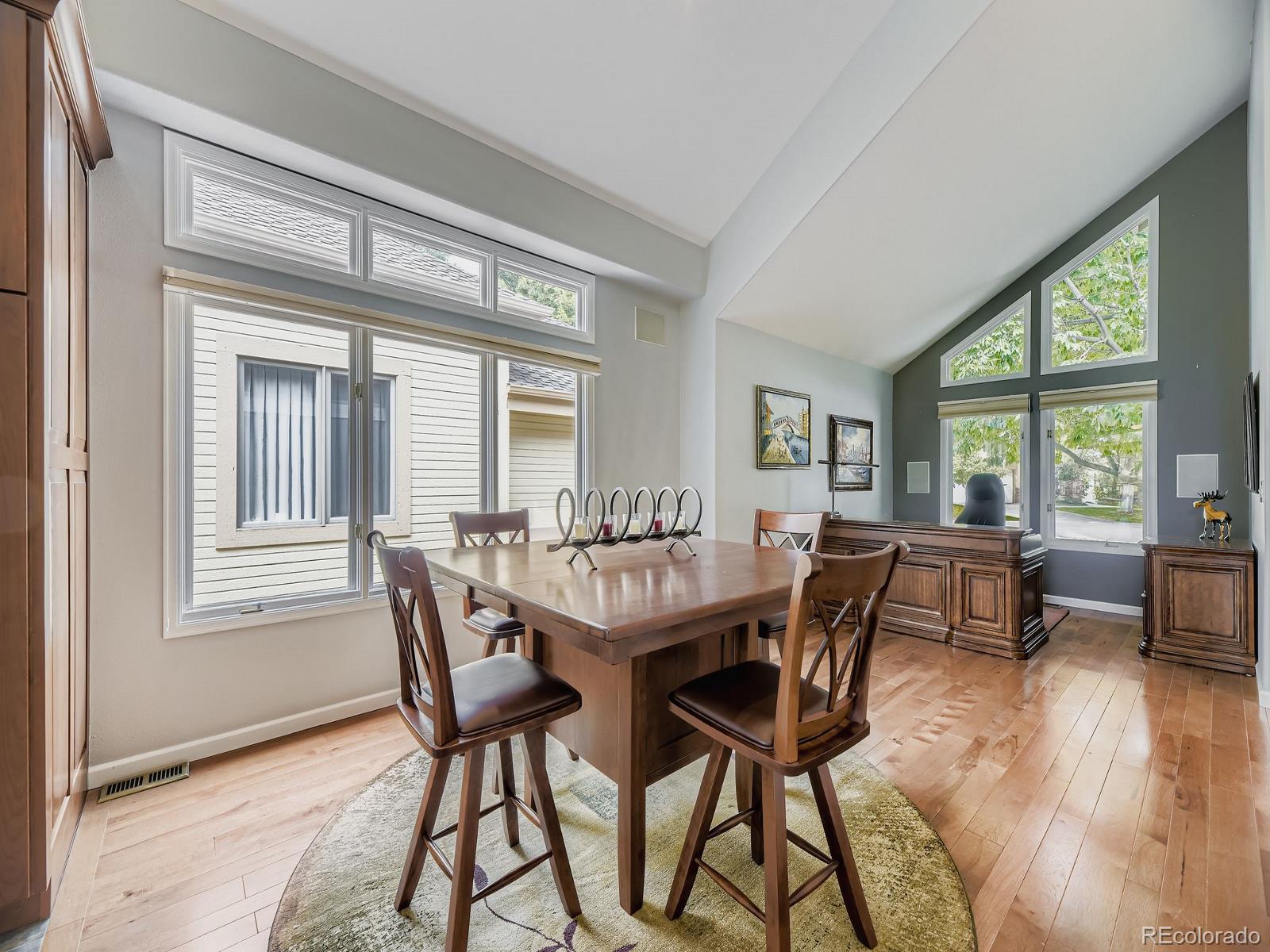15906 Double Eagle Drive Morrison, CO 80465 - Photo 6 of 34 a dining room with furniture and wooden floor