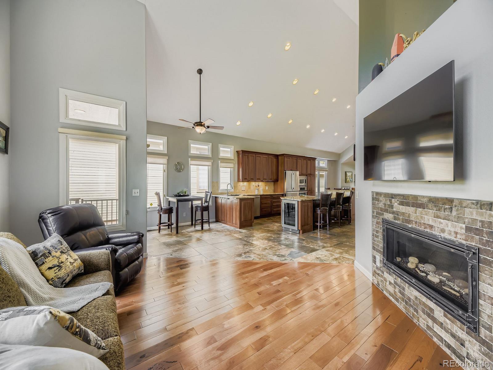 15906 Double Eagle Drive Morrison, CO 80465 - Photo 10 of 34 a living room with furniture and a flat screen tv