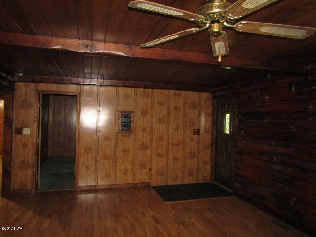 227 Hemlock Grove Road Newfoundland, PA 18445 - Photo 18 of 49 a view of empty room with wooden floor