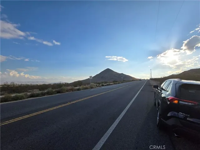 a view of street from balcony