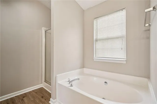 a white bath tub sitting next to a window