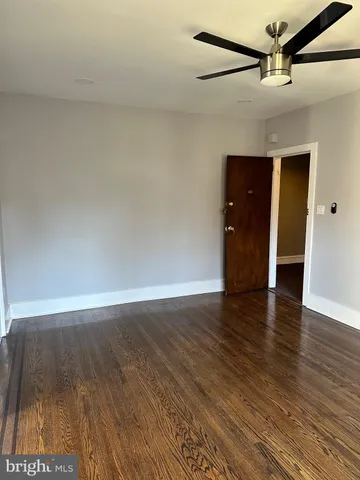 a view of an empty room and wooden floor