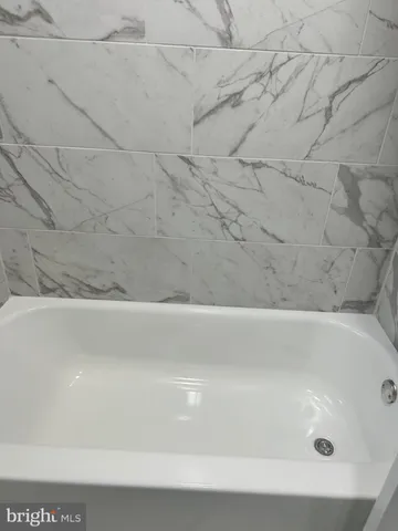 a bathroom with bathtub