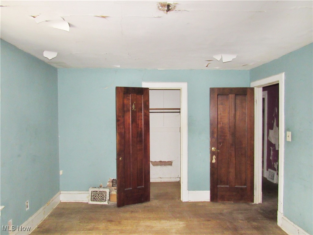 14450 Superior Road Cleveland, OH 44118 - Photo 26 of 35 Unfurnished bedroom with baseboards and wood finished floors