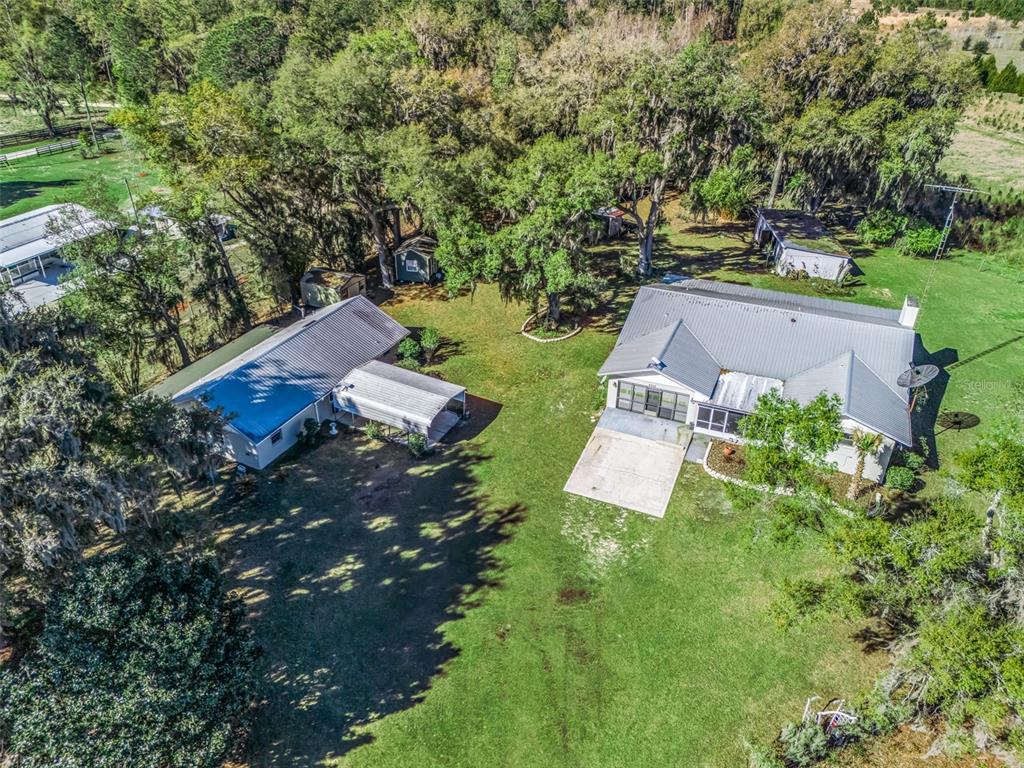 an aerial view of a house with garden