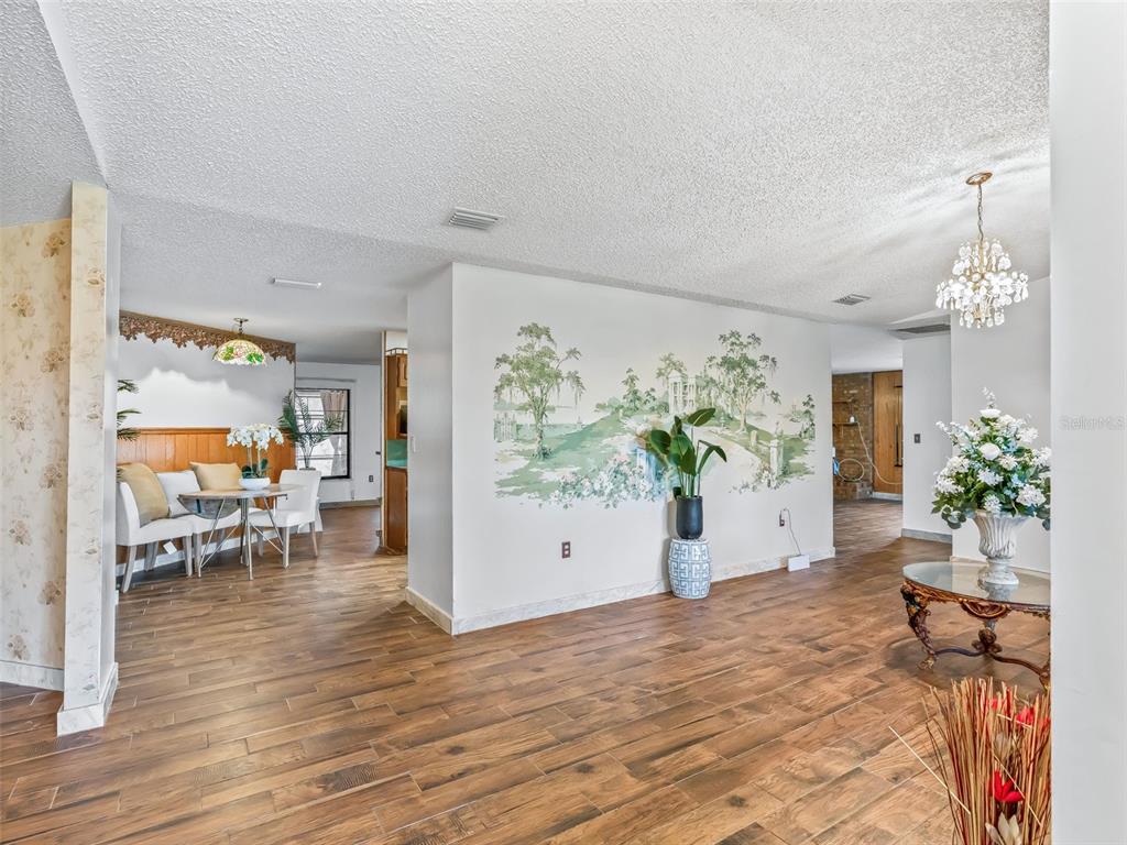 6350 Northeast 86th Avenue Bronson, FL 32621 - Photo 13 of 92 a view of a work space with furniture and front door
