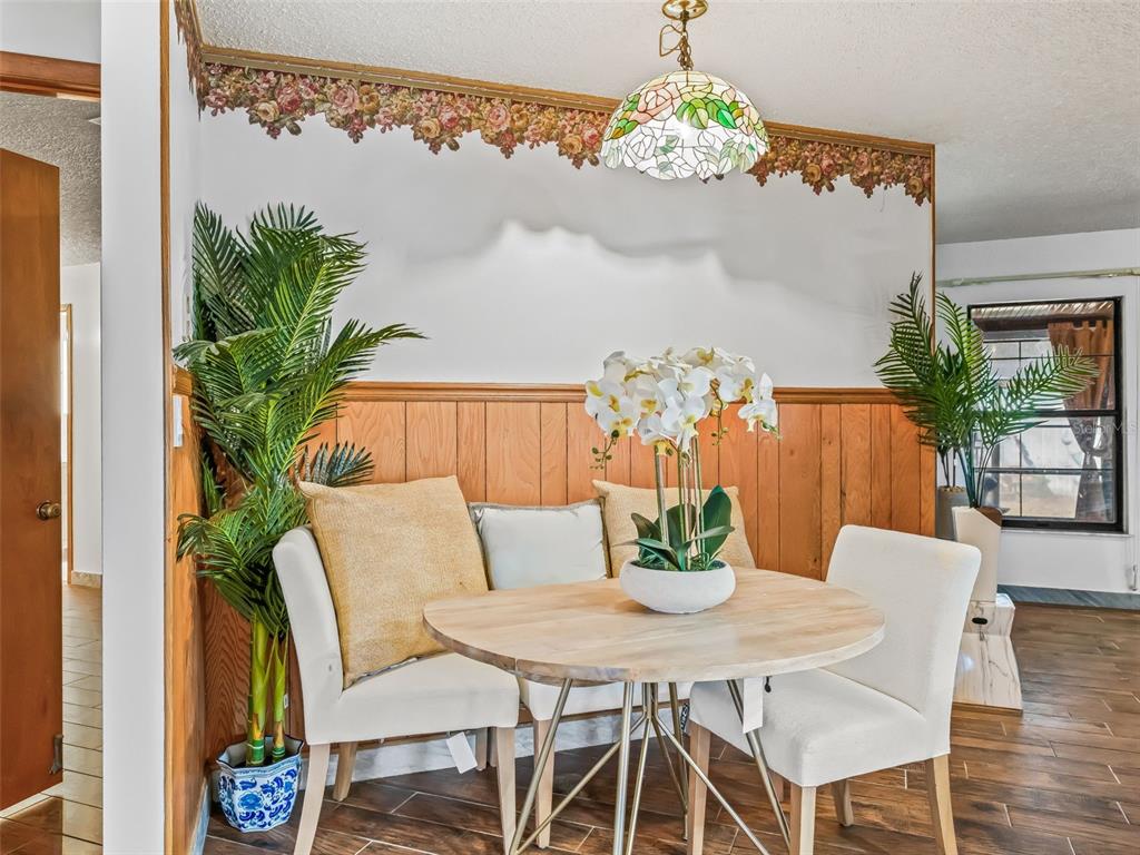 6350 Northeast 86th Avenue Bronson, FL 32621 - Photo 19 of 92 a view of a dining room with furniture window and wooden floor